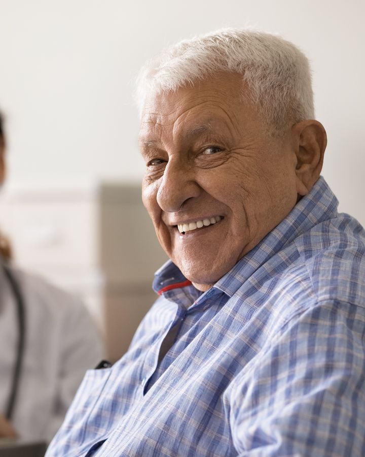 A smiling older patient at his primary care appointment